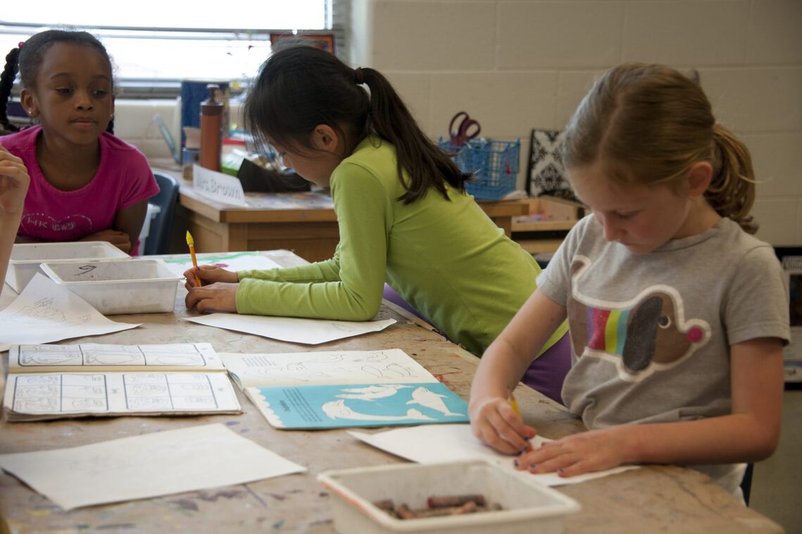 Children studying at a table